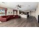 Open living room with hardwood floors and a view of the kitchen at 10855 E Elba Way, Scottsdale, AZ 85262