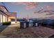 Evening view of outdoor kitchen and patio at 10855 E Elba Way, Scottsdale, AZ 85262