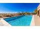 Inviting sparkling pool with a spacious patio and desert landscape views at 10855 E Elba Way, Scottsdale, AZ 85262