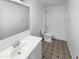 Clean bathroom, featuring a shower/tub combo, toilet and vanity at 12037 W Via Del Sol Ct, Sun City, AZ 85373