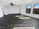 Bright and airy bedroom with ceiling fan and large windows at 12037 W Via Del Sol Ct, Sun City, AZ 85373