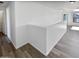 Light-filled hallway with wood-look floors at 12037 W Via Del Sol Ct, Sun City, AZ 85373