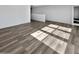 Bright and airy living room featuring hardwood floors at 12037 W Via Del Sol Ct, Sun City, AZ 85373