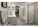 Modern bathroom with double vanity and walk-in shower at 12668 W Orangewood Ave, Glendale, AZ 85307