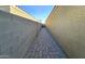 Sidewalk leading to the backyard with brick and gravel at 12668 W Orangewood Ave, Glendale, AZ 85307