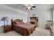 Cozy bedroom with double bed, dresser, and rocking chair at 13232 N 98Th Ave # N, Sun City, AZ 85351