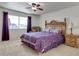 Spacious bedroom with king-size bed and ceiling fan at 13232 N 98Th Ave # N, Sun City, AZ 85351