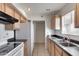 View of kitchen with appliances and tile floor at 13232 N 98Th Ave # N, Sun City, AZ 85351