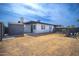 Backyard view of the home with a storage shed and privacy fence at 1410 E Bishop Dr, Tempe, AZ 85282