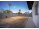 Spacious backyard with block fence, ready for landscaping and outdoor activities at 1410 E Bishop Dr, Tempe, AZ 85282