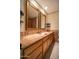 Bathroom with a copper sink, two ornate mirrors, granite counters and tiled backsplash at 1410 E Bishop Dr, Tempe, AZ 85282