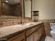 This bathroom has a vanity with granite counters and two mirrors at 1410 E Bishop Dr, Tempe, AZ 85282