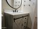 This bathroom has a vanity with white counters and black hardware at 1410 E Bishop Dr, Tempe, AZ 85282