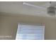 Bedroom features a ceiling fan with light, and a window with blinds at 1410 E Bishop Dr, Tempe, AZ 85282