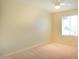 Carpeted bedroom with ceiling fan and window letting in natural light at 1410 E Bishop Dr, Tempe, AZ 85282