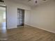 This bedroom has wood flooring and a closet at 1410 E Bishop Dr, Tempe, AZ 85282