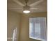 The bedroom features a ceiling fan with light, and a window with blinds at 1410 E Bishop Dr, Tempe, AZ 85282