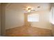 Bright bedroom with tile floors, ceiling fan, and natural light from large windows at 1410 E Bishop Dr, Tempe, AZ 85282