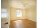 Bright bedroom featuring wood-look flooring, ceiling fan, and window with natural light at 1410 E Bishop Dr, Tempe, AZ 85282