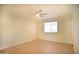 Inviting bedroom with bright window, neutral walls, and a ceiling fan at 1410 E Bishop Dr, Tempe, AZ 85282