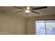 This bedroom has a ceiling fan and a window with blinds at 1410 E Bishop Dr, Tempe, AZ 85282