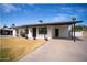 Charming single-story home featuring a covered front porch and well-maintained landscaping at 1410 E Bishop Dr, Tempe, AZ 85282