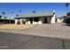 Inviting single-story home with covered parking, xeriscaped front yard, and an attached basketball court at 1410 E Bishop Dr, Tempe, AZ 85282