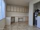 Laundry room with built-in cabinets, desk space and great natural light at 1410 E Bishop Dr, Tempe, AZ 85282