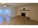 Living room with a cozy fireplace and an adjacent dining area filled with natural light at 1410 E Bishop Dr, Tempe, AZ 85282