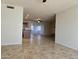 Spacious living room with tile floors opens to the kitchen, perfect for entertaining guests at 1410 E Bishop Dr, Tempe, AZ 85282