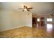 Open concept living room with tile flooring and a ceiling fan at 1410 E Bishop Dr, Tempe, AZ 85282