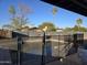 The fenced in pool is surrounded by mature landscaping at 1410 E Bishop Dr, Tempe, AZ 85282