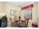 Small dining area with glass table and four chairs at 14950 W Mountain View Blvd # 4305, Surprise, AZ 85374