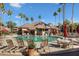 Inviting community pool with lounge chairs and tables at 14950 W Mountain View Blvd # 4305, Surprise, AZ 85374