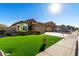 House exterior showcasing a front yard, driveway, and neighborhood context at 15415 S 37Th Pl, Phoenix, AZ 85044