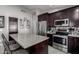 Modern kitchen with granite countertops, stainless steel appliances and an island at 15415 S 37Th Pl, Phoenix, AZ 85044