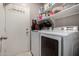 Laundry room with washer, dryer, and ample shelving at 15415 S 37Th Pl, Phoenix, AZ 85044