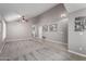 Living room with high ceilings, ceiling fan, and neutral color palette at 15415 S 37Th Pl, Phoenix, AZ 85044