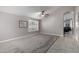 Living room with high ceilings, ceiling fan, and view to adjacent rooms at 15415 S 37Th Pl, Phoenix, AZ 85044