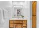 Bathroom with single vanity, mirror, and wood cabinets at 15859 N Nyack Dr, Fountain Hills, AZ 85268