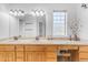 Double vanity bathroom with wood cabinets and a makeup vanity at 15859 N Nyack Dr, Fountain Hills, AZ 85268