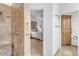 Bathroom with walk-in shower, tiled walls, and a linen closet at 15859 N Nyack Dr, Fountain Hills, AZ 85268