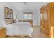 Bright bedroom with large bed and wooden dresser at 15859 N Nyack Dr, Fountain Hills, AZ 85268