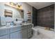 Bathroom with gray cabinets, a bathtub, and a modern sink at 15959 E Brodiea Dr, Fountain Hills, AZ 85268