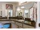 Bathroom with granite vanity, dual sinks, and a large mirror at 15959 E Brodiea Dr, Fountain Hills, AZ 85268