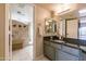 Modern bathroom with gray cabinets and a walk-in shower at 15959 E Brodiea Dr, Fountain Hills, AZ 85268