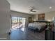 Main bedroom with king-size bed and access to private patio at 15959 E Brodiea Dr, Fountain Hills, AZ 85268