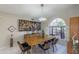 Mid-century modern dining room with wood table and unique chandelier at 15959 E Brodiea Dr, Fountain Hills, AZ 85268