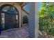 Elegant entryway with arched windows and a black door at 15959 E Brodiea Dr, Fountain Hills, AZ 85268