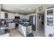 Modern kitchen with island, stainless steel appliances, and white cabinets at 15959 E Brodiea Dr, Fountain Hills, AZ 85268